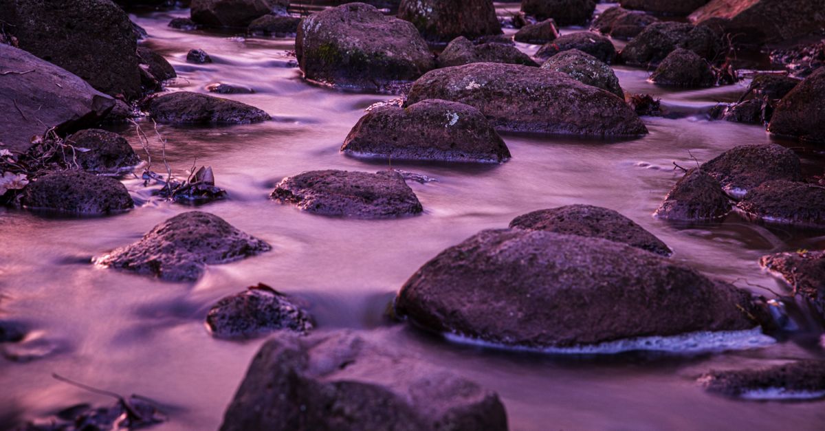 Water And Rocks Background Long Exposure Picture of Water Flowing between Rocks · Free Stock Photo