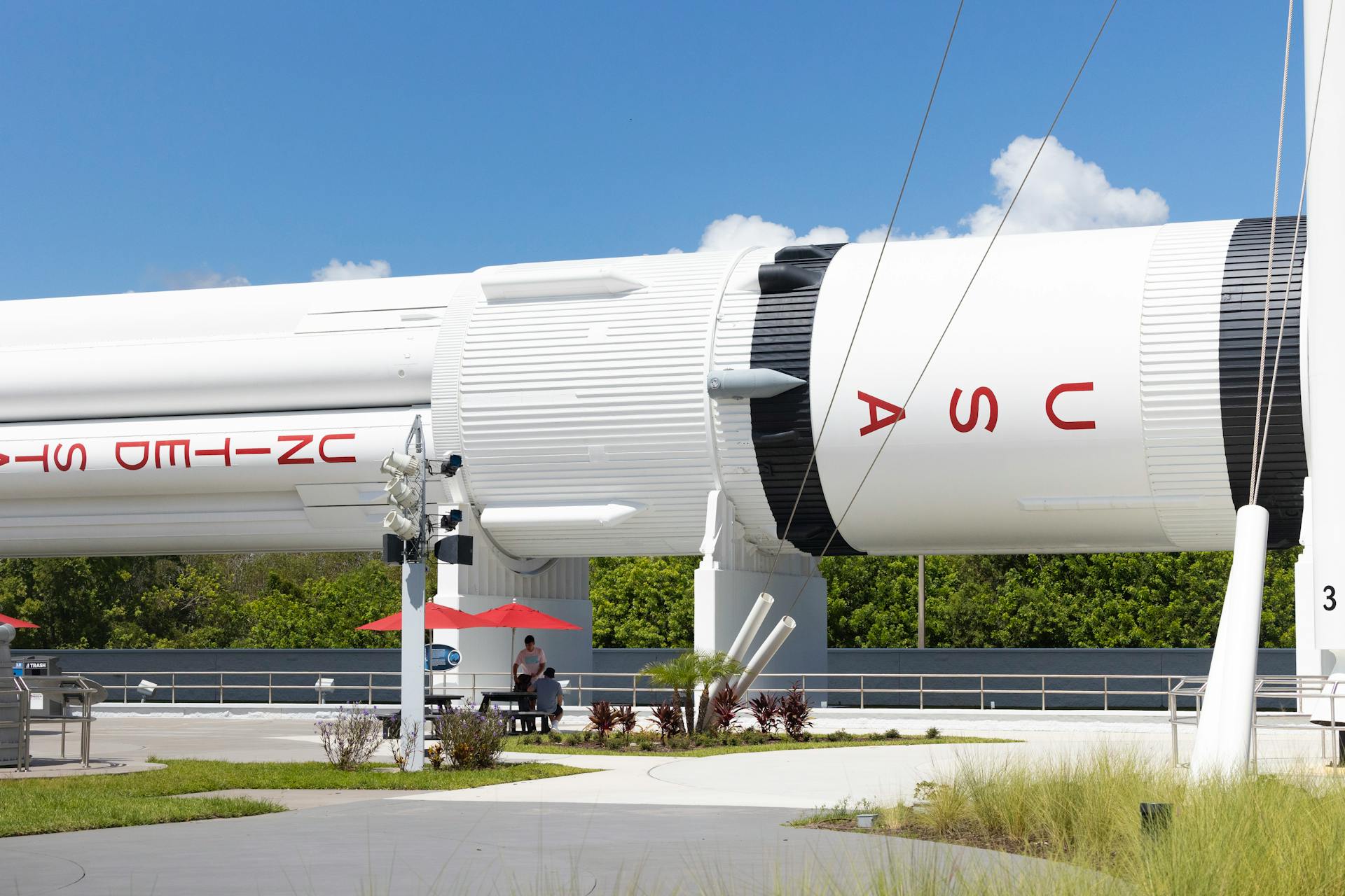 A detailed view of a rocket at Cape Canaveral's Kennedy Space Center with clear skies.