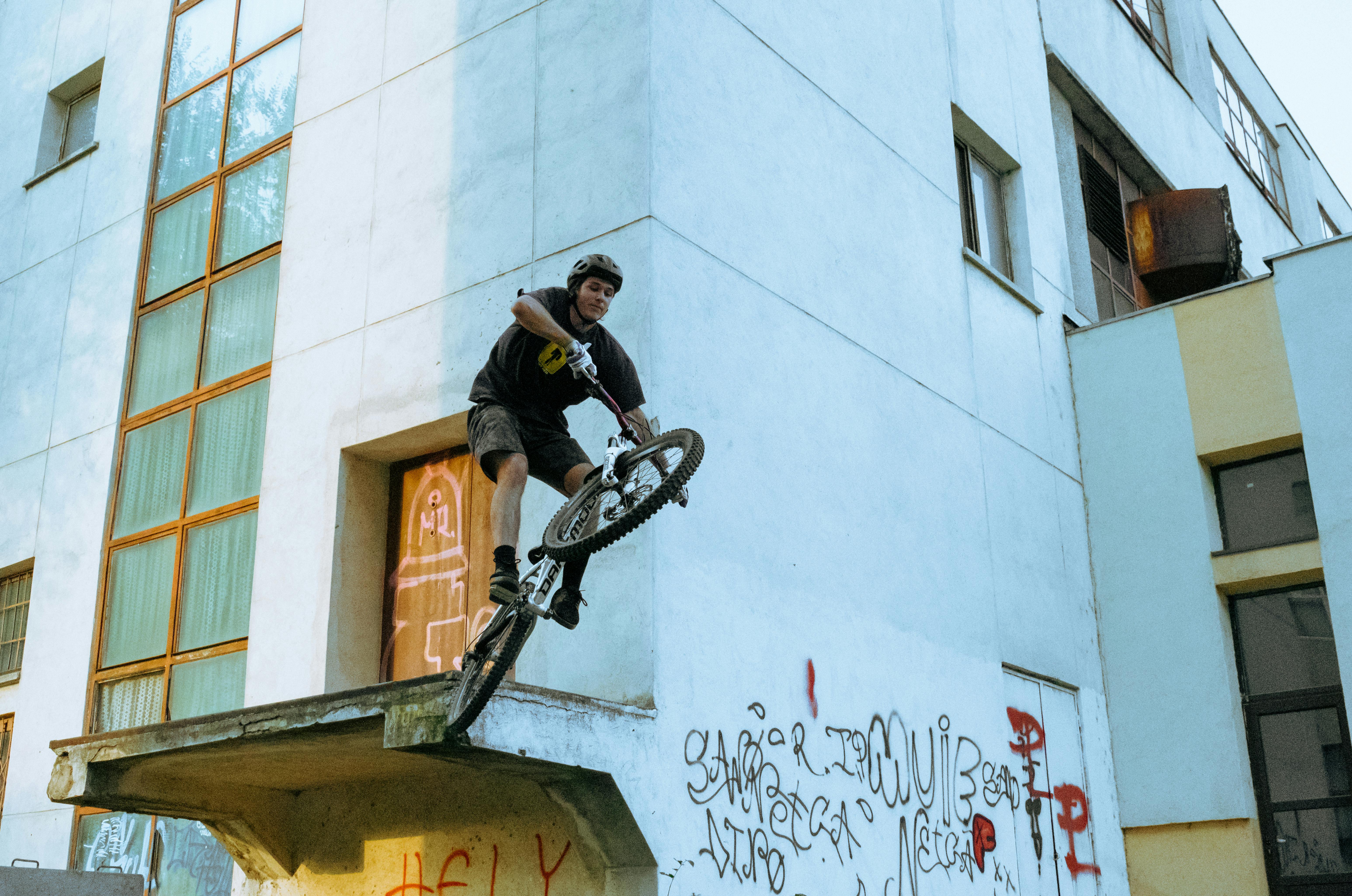 Man In Black Shirt Riding A Bicycle · Free Stock Photo