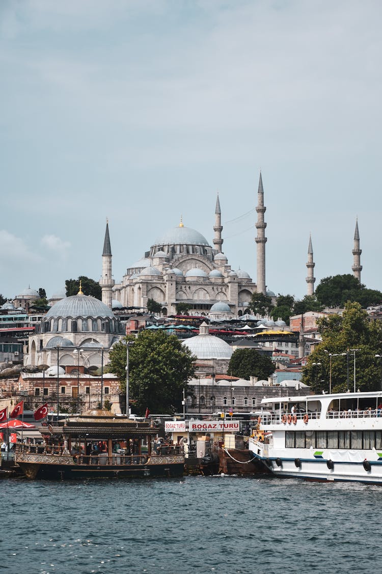 Boats Moored By The River In A City