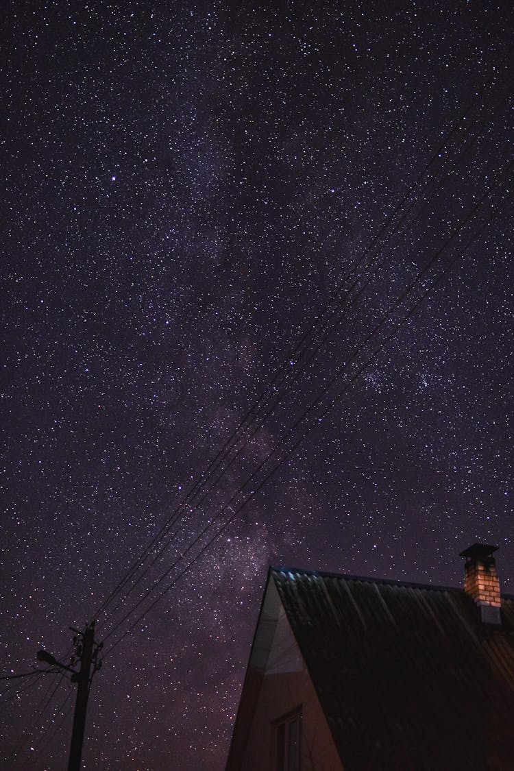 Starry Night Sky Above A House