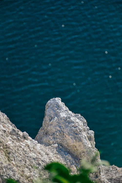 Rock Formation Beside Body of Water