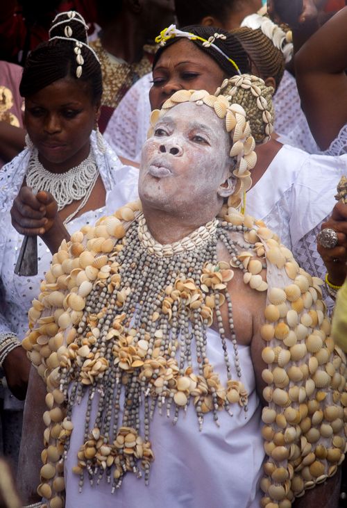 Free A vibrant traditional festival showcasing participants in cultural attire adorned with shells and face paint. Stock Photo