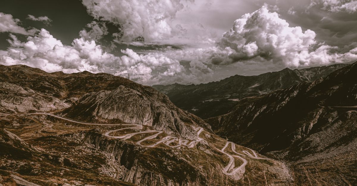 Breathtaking landscape of winding roads through the Swiss Alps at Gotthard Pass.