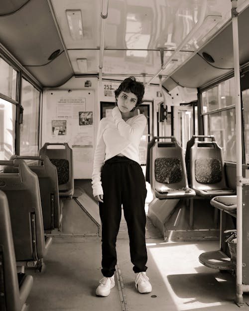 Woman Standing in a Bus