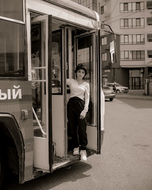 Woman Standing In Bus Doors
