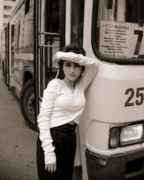 Woman Leaning on a Bus