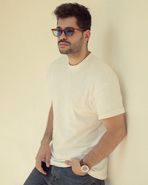 A Man in a White Shirt Wearing Sunglasses