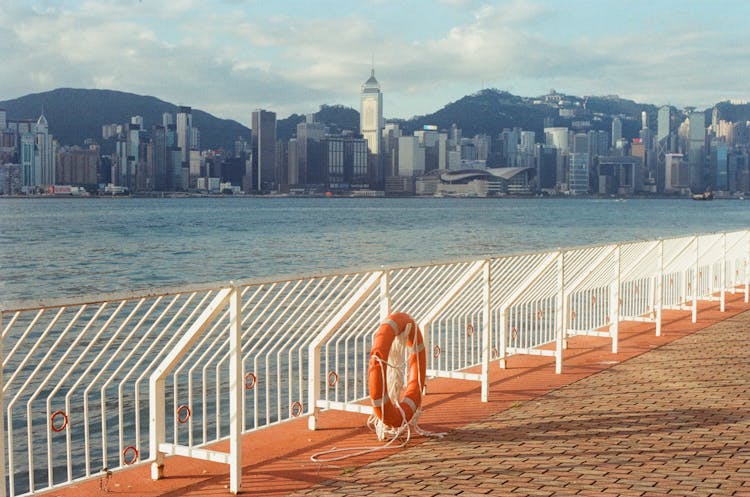 Waterfront And A Metal Barrier On A Pier