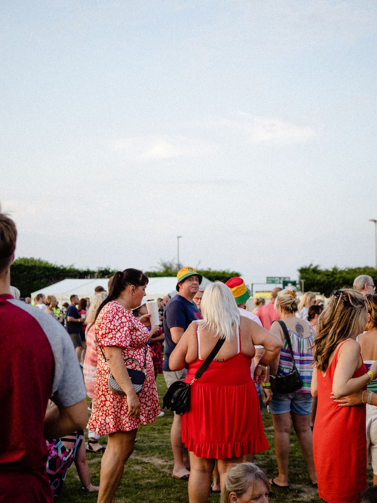 Guests gathering at an outdoor summer festival