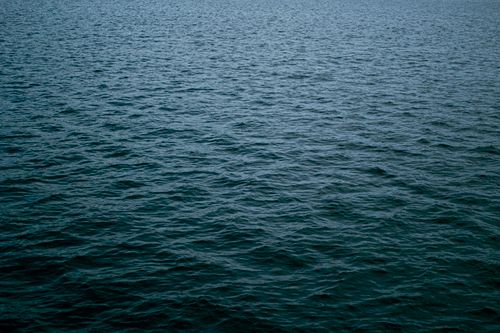 Free Calm ocean water with gentle ripples near Stirling, Scotland, UK. Stock Photo