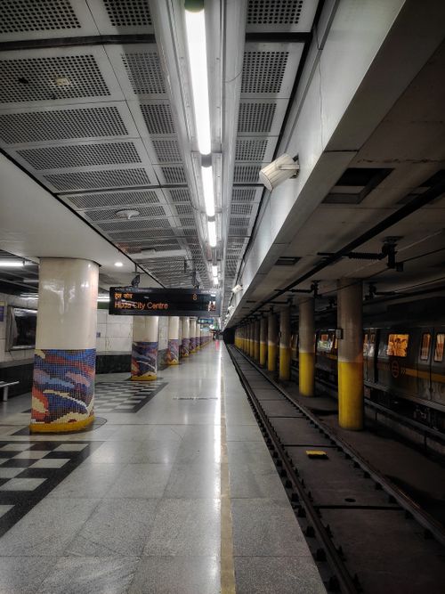 Free Delhi metro station showing an empty underground platform and tracks. Stock Photo
