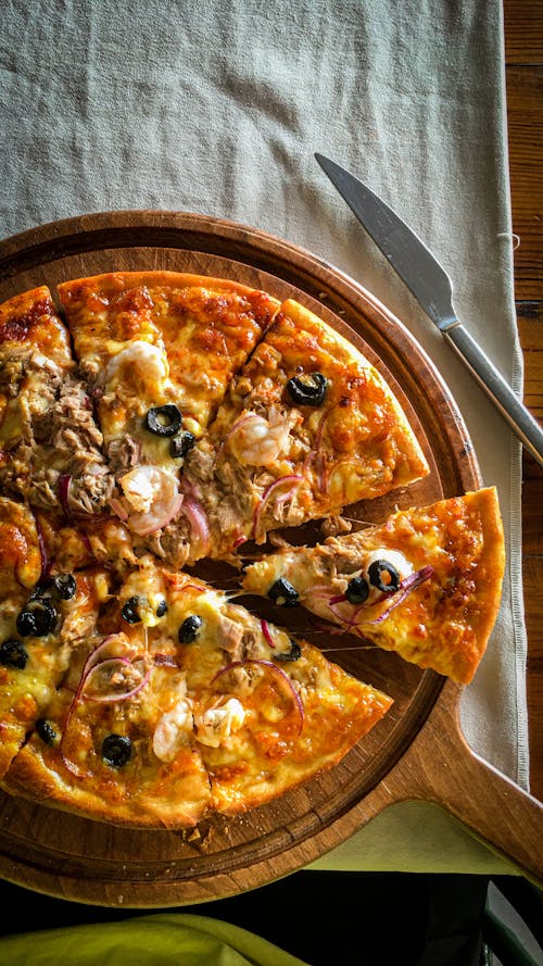 Pizza on Round Wooden Board 