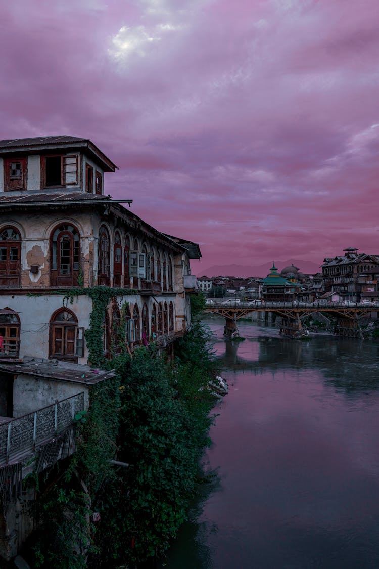 City And River Under Purple Clouds