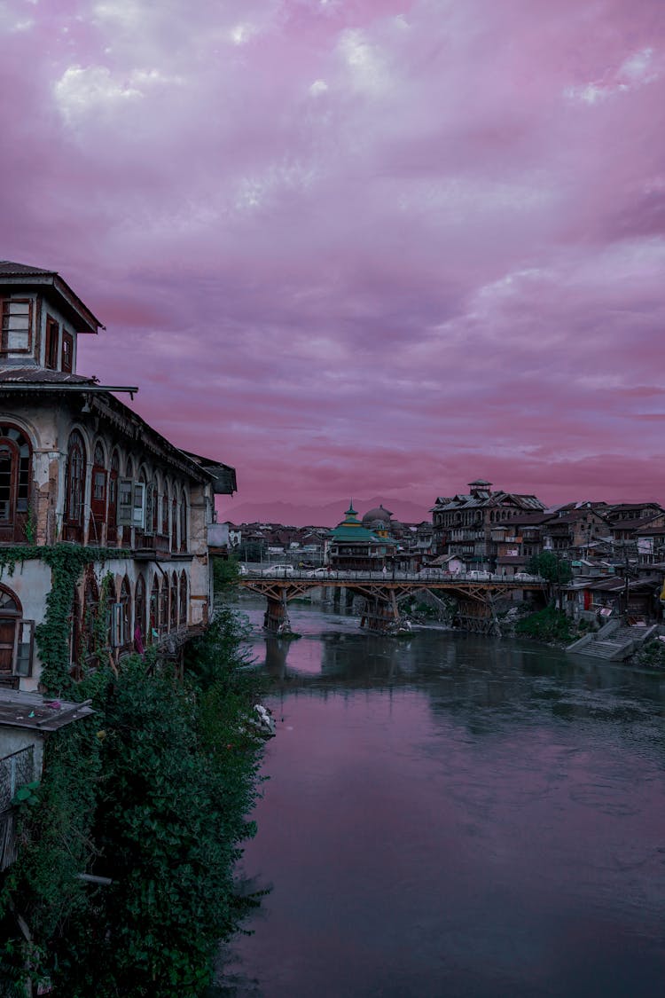 City And River Under Purple Clouds