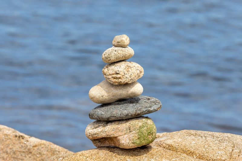 Serene stone stack by the seaside, evoking tranquility and balance.