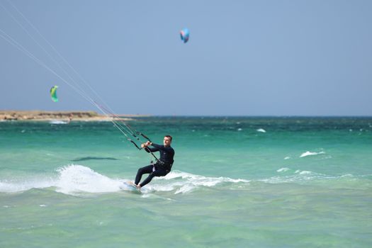 Man Wakeboarding by Sea Shore