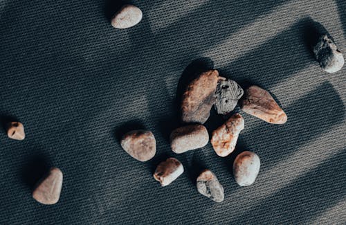 Stones on Gray Textile