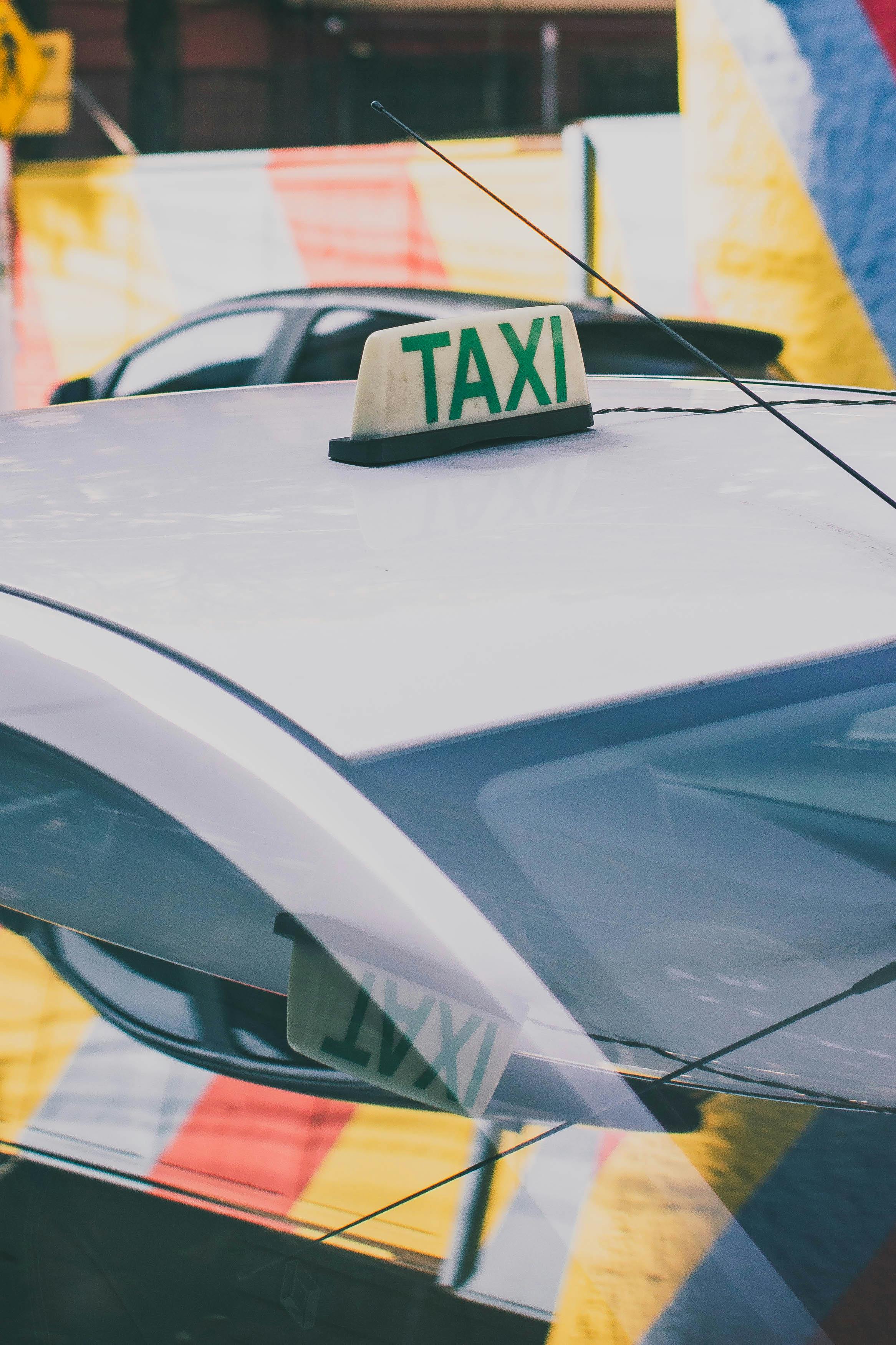 Close-up of a taxi in São Paulo, Brazil highlighting its roof sign with urban background.