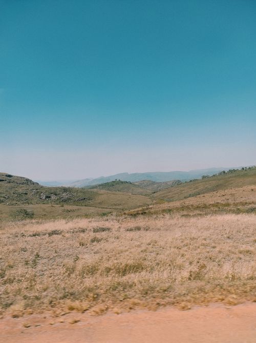 Free Explore the tranquil beauty of Santana do Riacho's vast rolling hills under a clear blue sky. Stock Photo