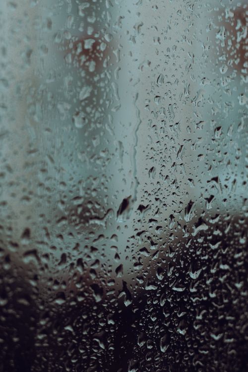 Free Water droplets on a glass window create a moody, reflective scene in Istanbul, Turkey. Stock Photo