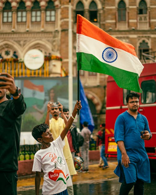 A Boy Holding the Flag of India
