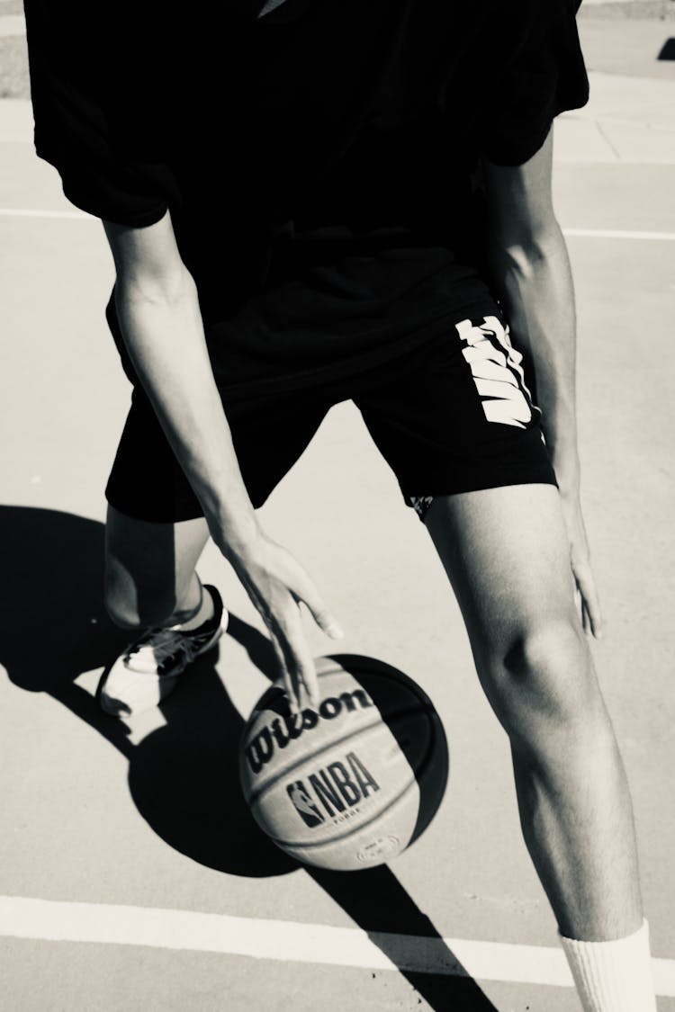 Man In Sportswear Playing Basketball