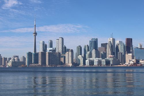 Free View of the Toronto skyline including the iconic CN Tower on a clear day. Stock Photo