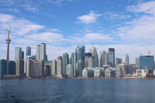 Breathtaking view of Toronto's skyline with CN Tower, high-rises, and waterfront.