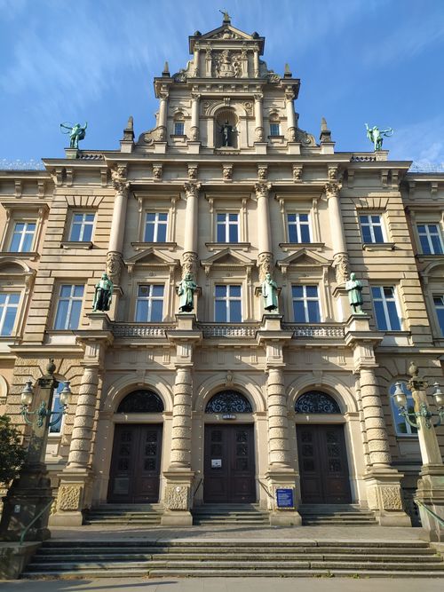 Free Symmetrical neoclassical building facade with statues in Hamburg, Germany. Stock Photo