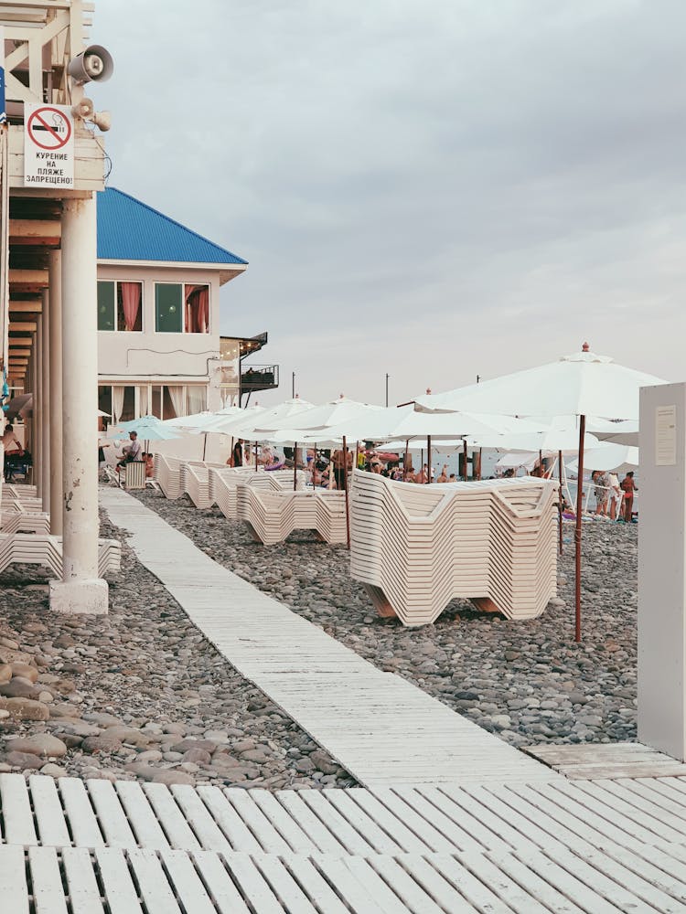 Stacked Beach Chairs On Shore