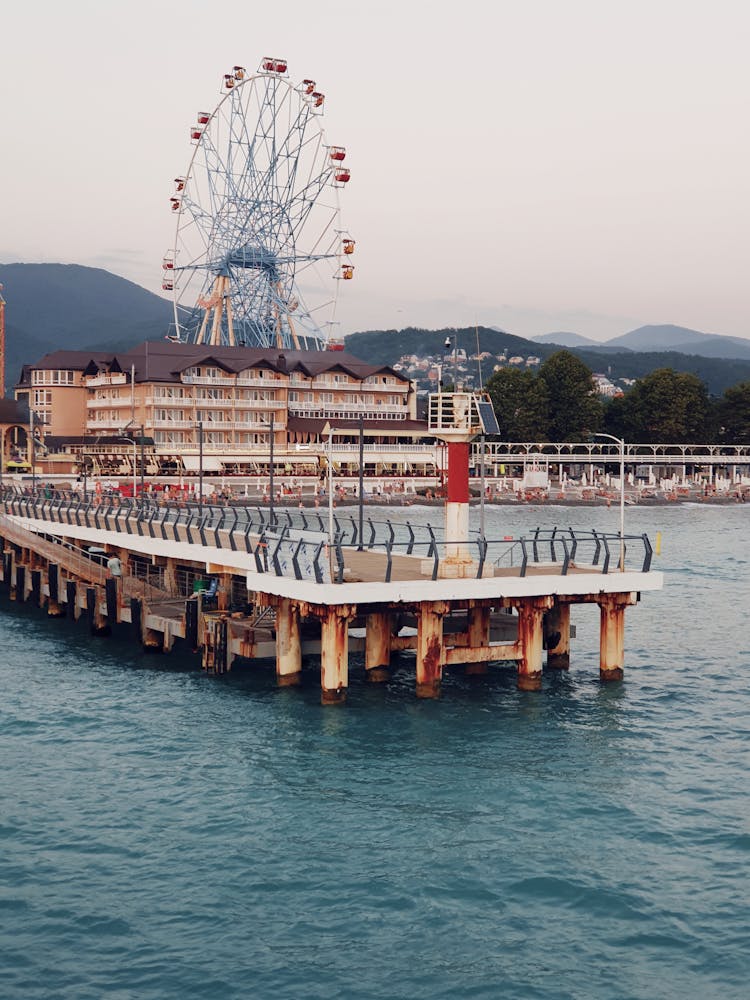 Pier And Ferris Wheel In Seaside Resort