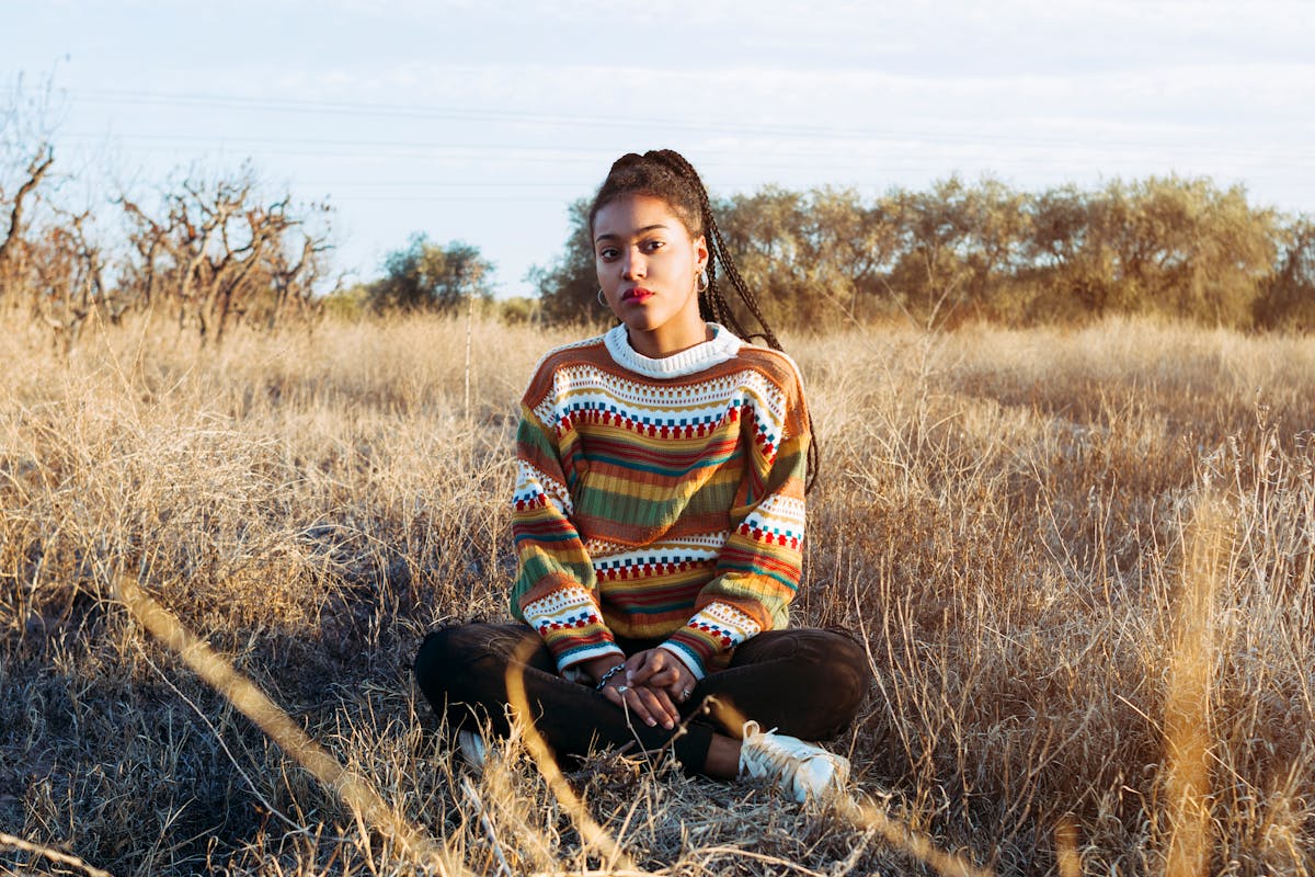 Basketball player dribbling under bright arena lights
