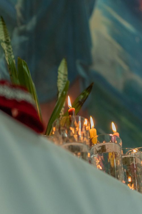 Free Close-up of colorful candles lit in crystal glasses, creating a warm atmosphere. Stock Photo