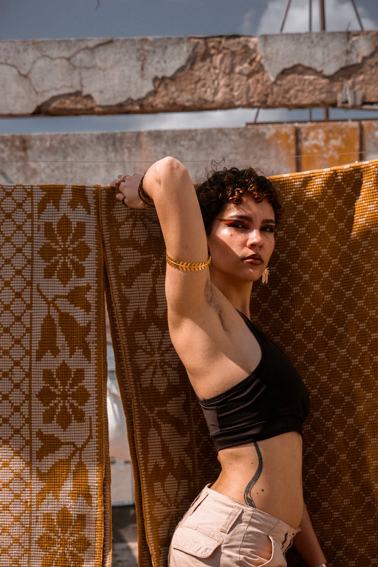 Young Woman With Tattoos And Makeup Posing Outdoors 