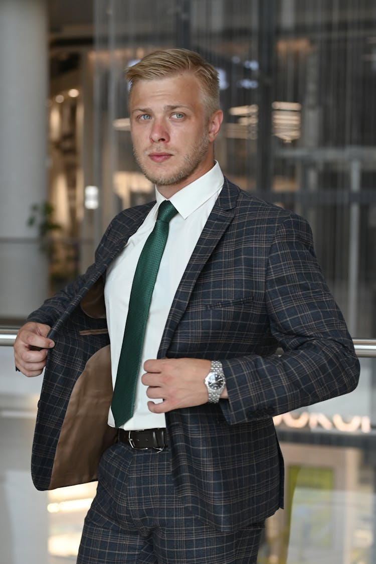 Handsome Man Wearing Plaid Suit And Green Necktie