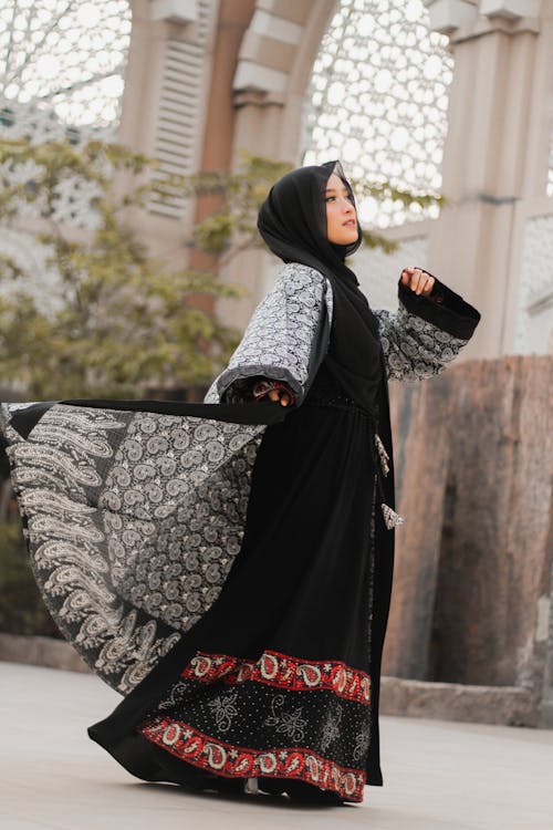 A Woman in Black Hijab and Black Abaya
