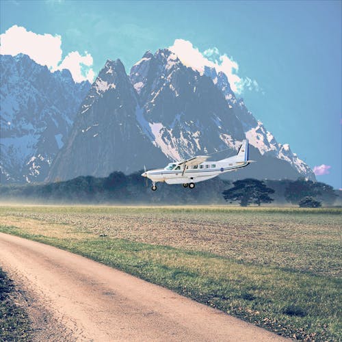 Free stock photo of airplane, landing, mountains