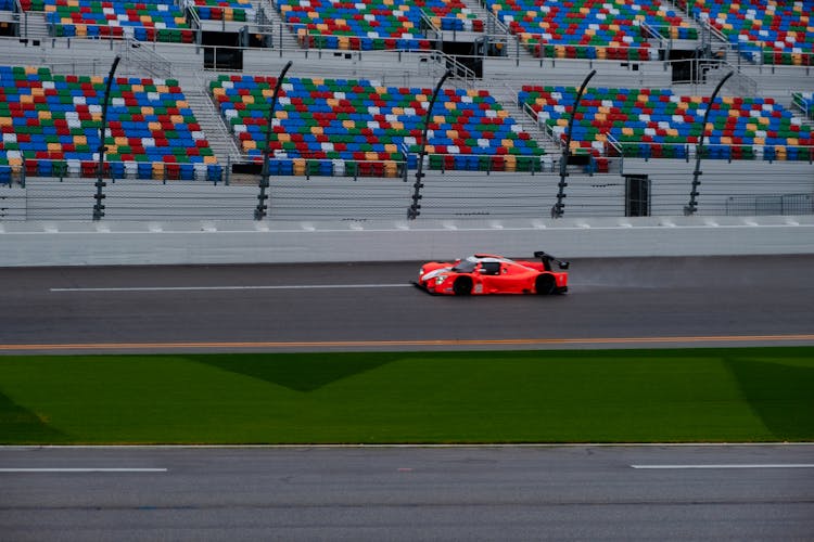 Red Car Racing On Track