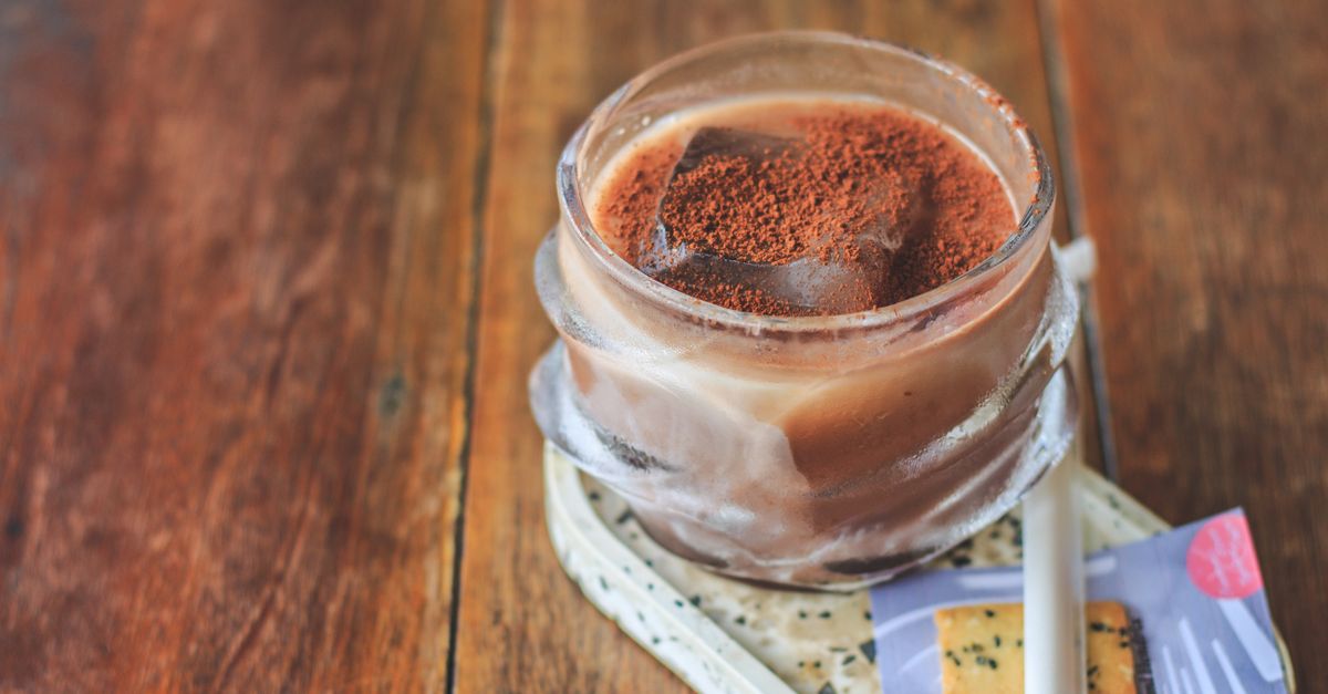 Beverage on Glass Cup with Chocolate Powder Garnish · Free Stock Photo