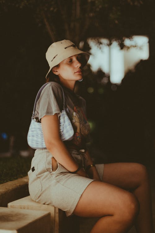 Woman Wearing a Brown Bucket Hat