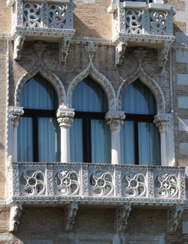 A beautifully ornate baroque façade with arched balconies and intricate designs.