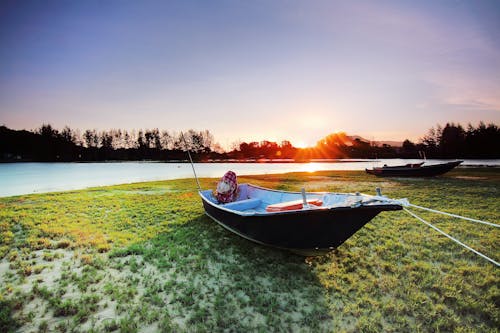 Free Boat on Body of Water during Sunset Stock Photo