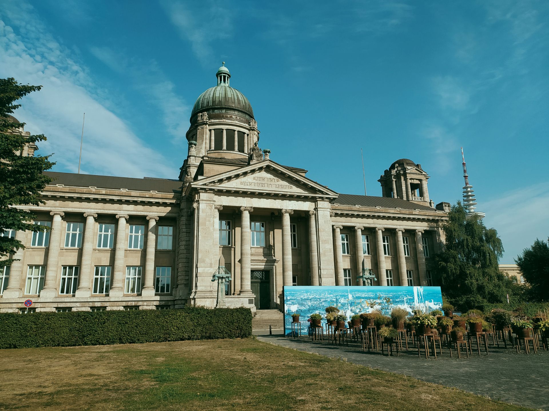 Front view of an elegant old courthouse building in Germany under a clear blue sky.