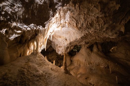 Explore the mesmerizing textures of stalactites and stalagmites in this stunning cave interior.