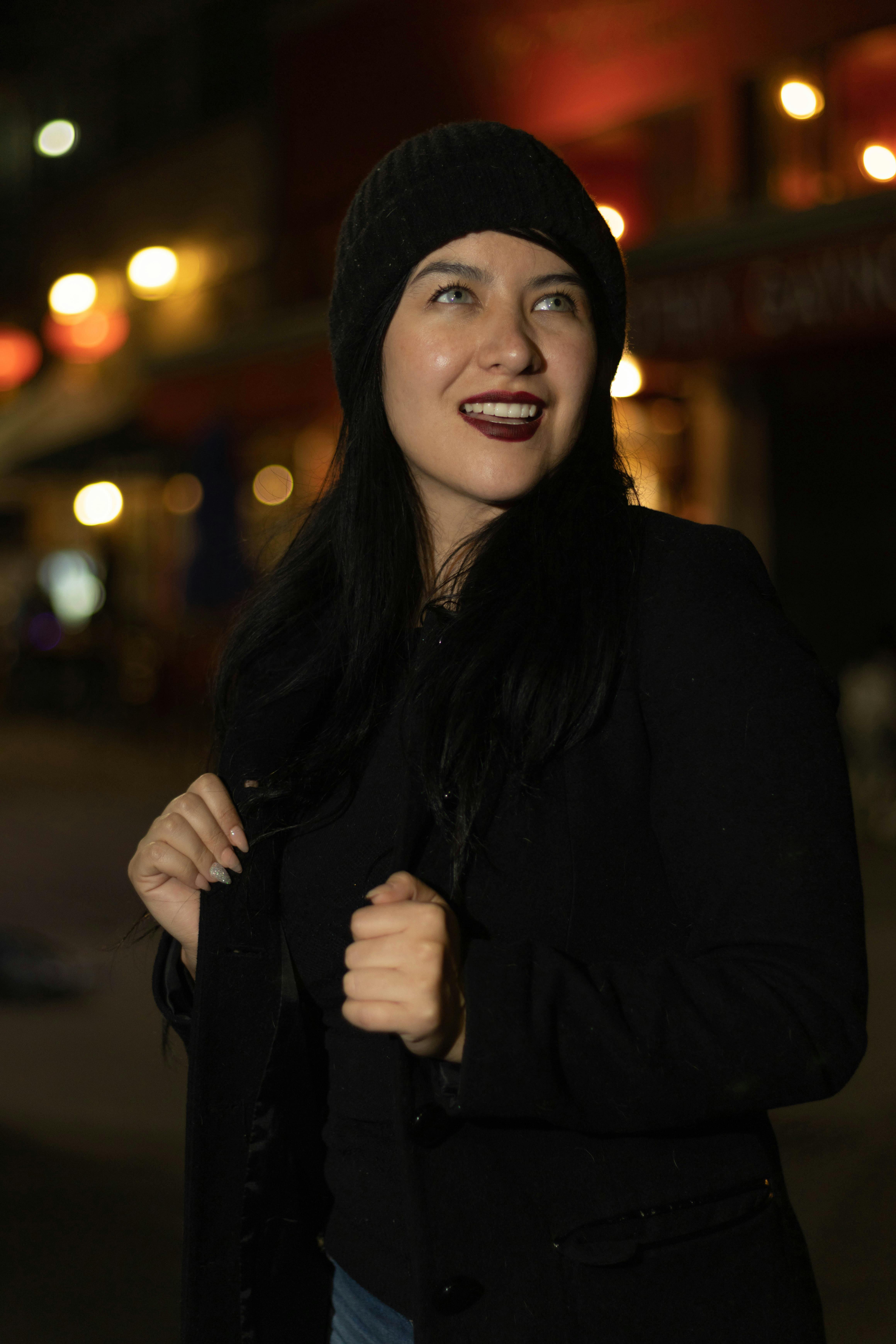 Woman Wearing a Black Knit Cap and a Coat · Free Stock Photo
