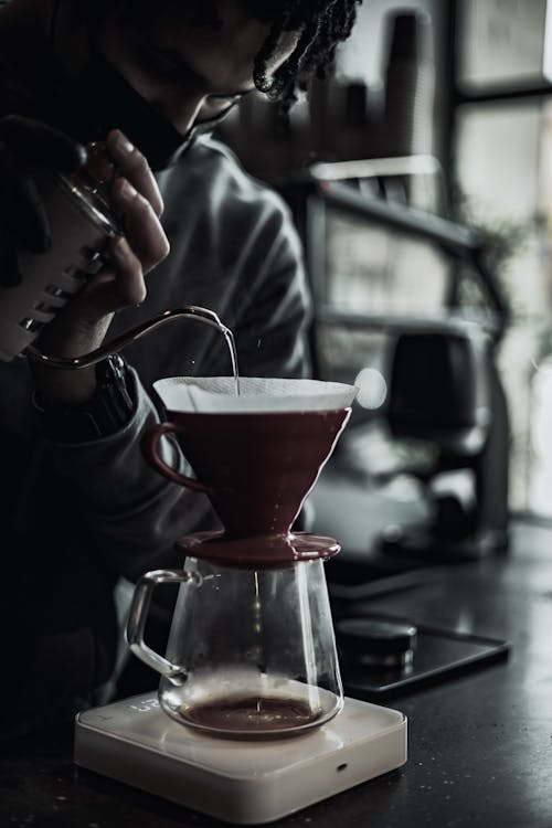 Free A Man Making A Pour Over Coffee Stock Photo