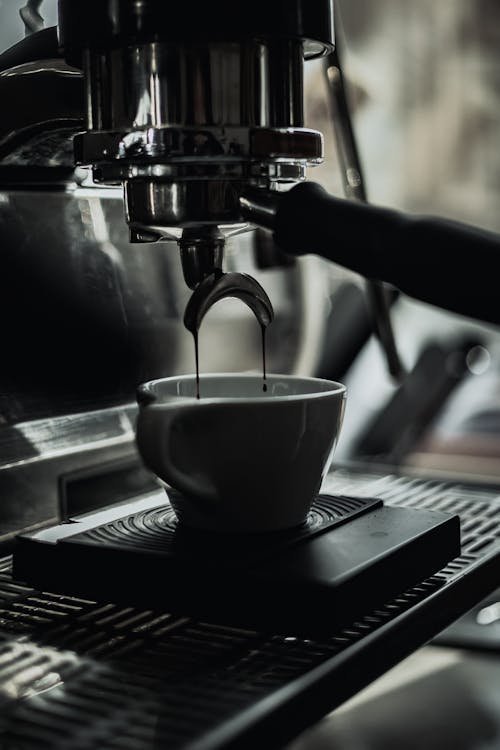Free Ceramic Cup on a Coffee Machine Stock Photo