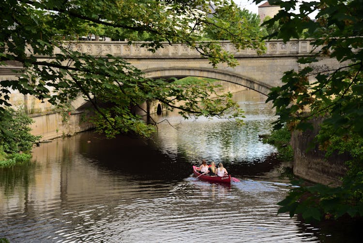 Group Of Women Riding A Canoe