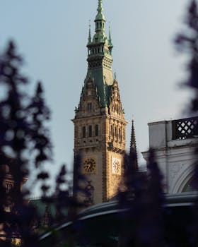 Stunning view of Hamburg Town Hall tower with gothic architecture details.